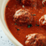 vegan beyond meat meatballs in a dish with sauce