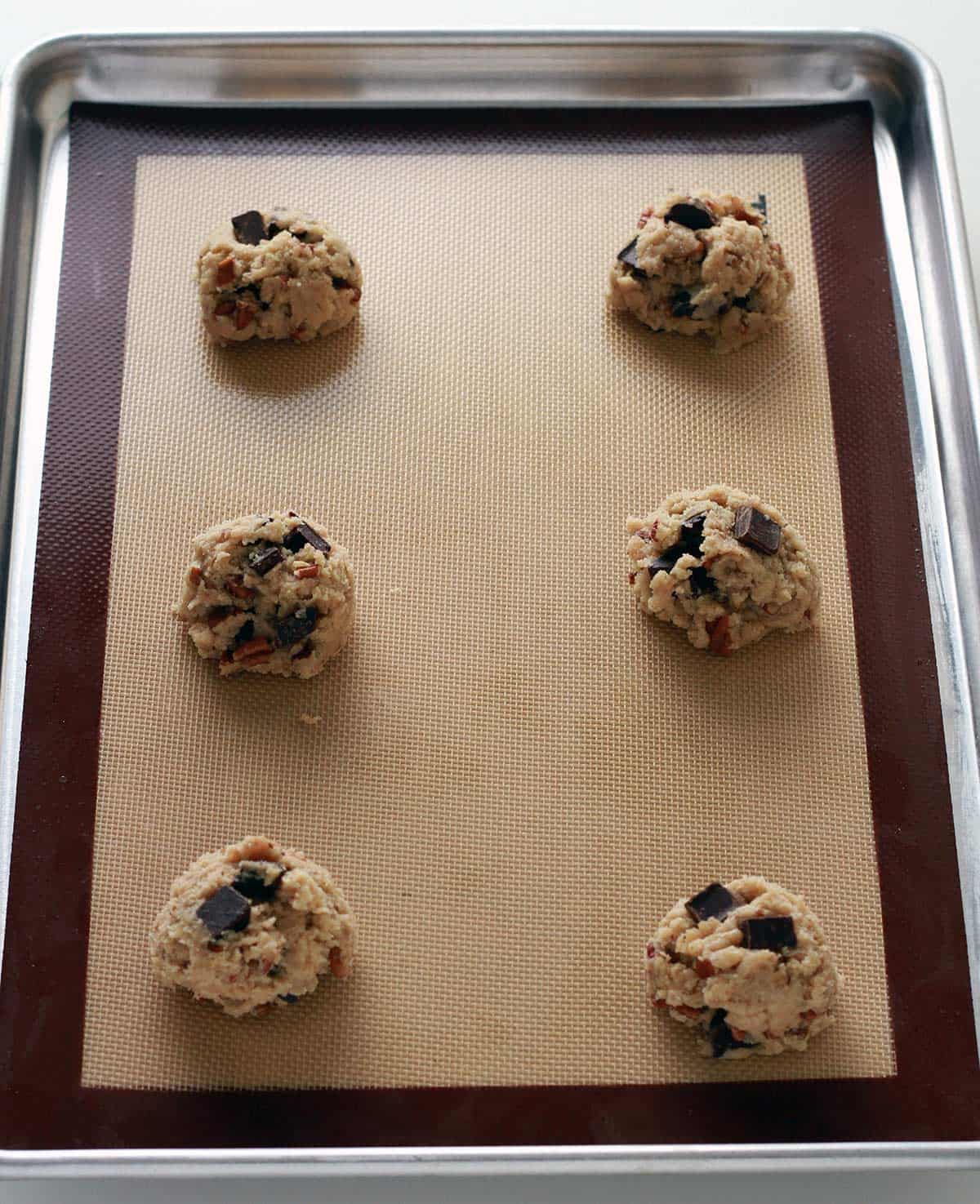 chocolate chip cookie dough on a sheet pan