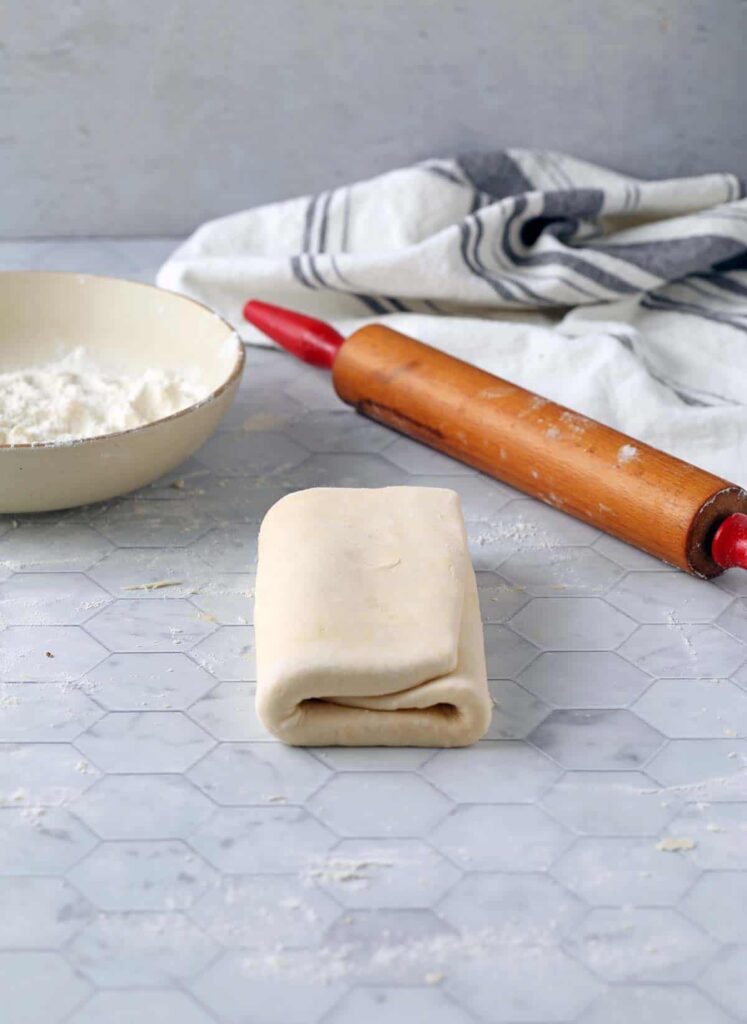 vegan puff pastry with a rolling in and flour