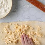 Vegan Puff Pastry hand spreading butter