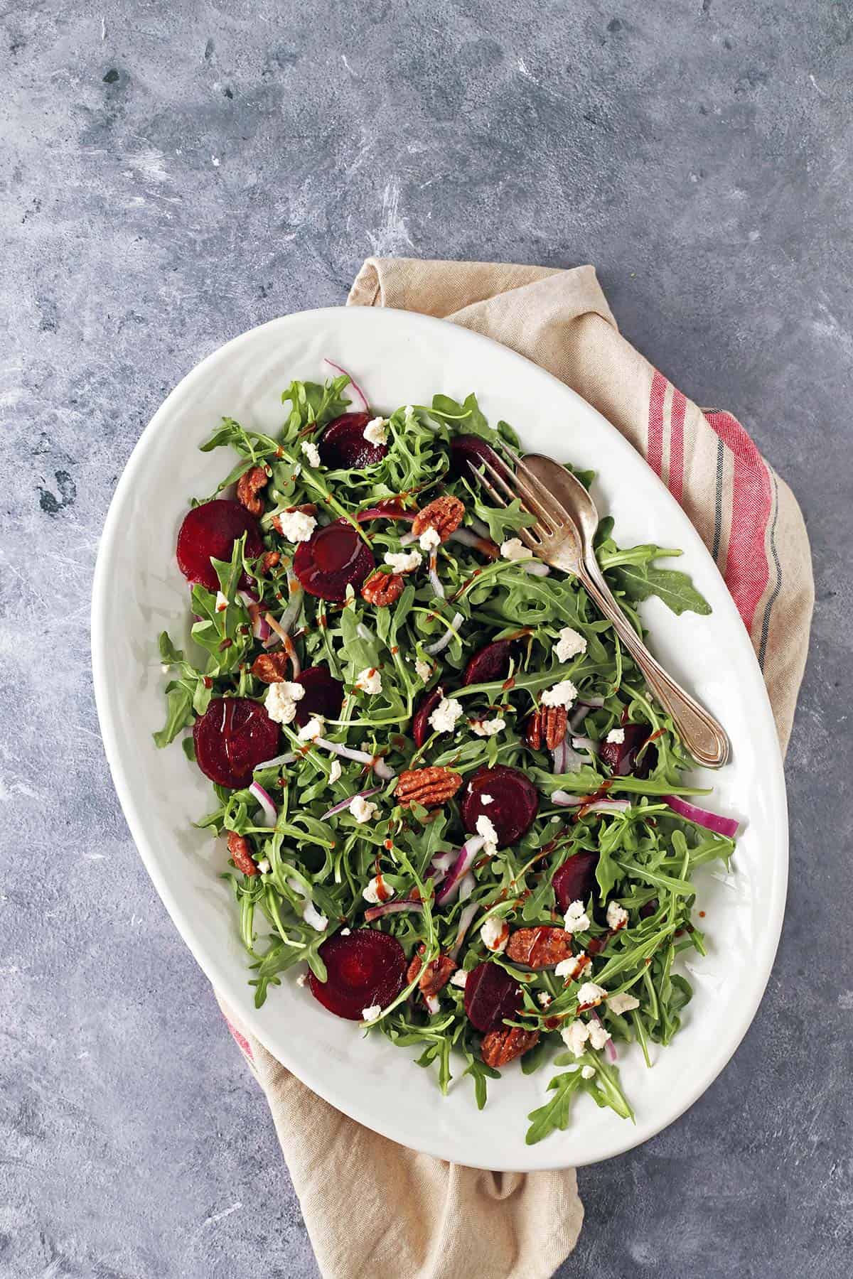 vegan beet salad on a white platter