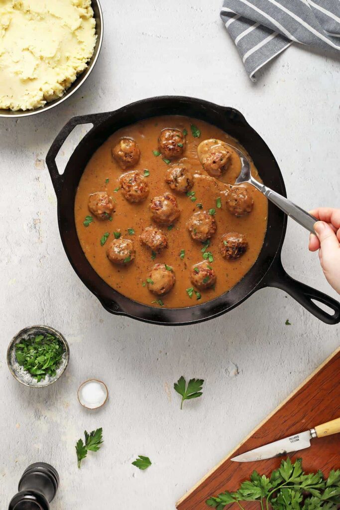vegan swedish meatballs in a cast iron pan